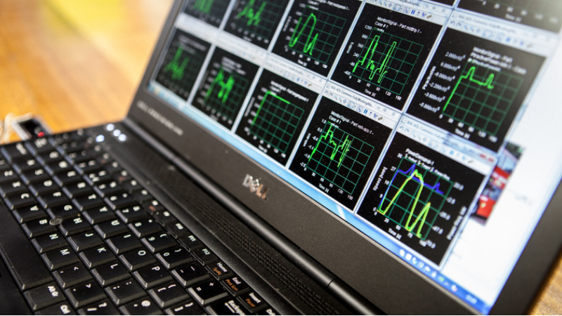 A laptop screen showing data charts